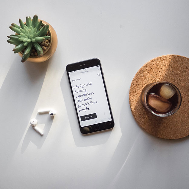 Phone over the table with white background - serpweave